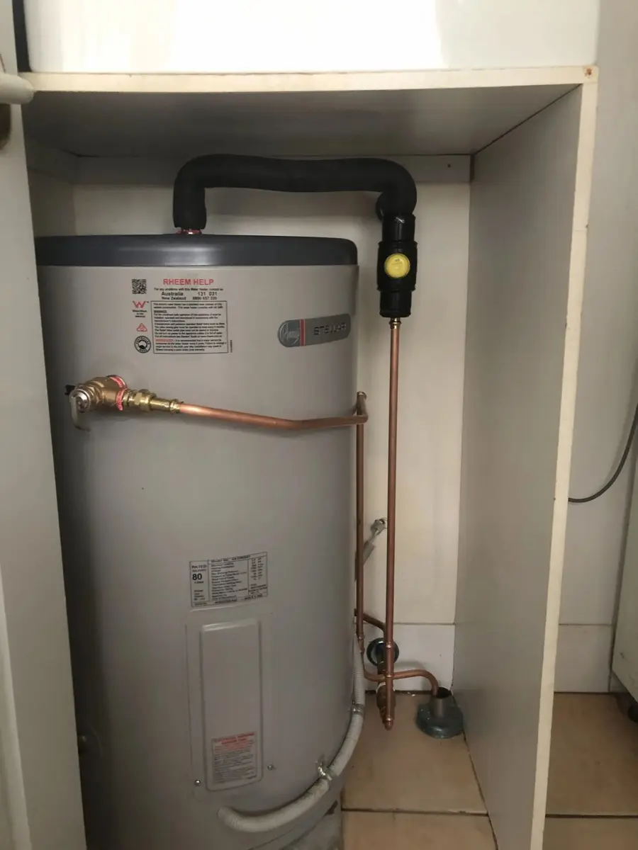 Electric storage hot water system installed in a tight cupboard space