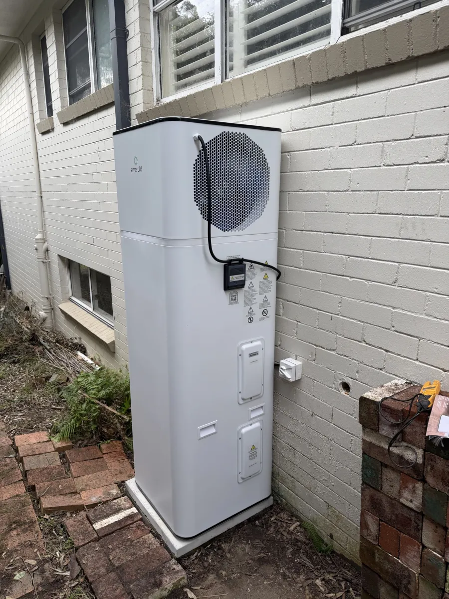 Rear view of Emerald heat pump showing compressor grille in Forestville