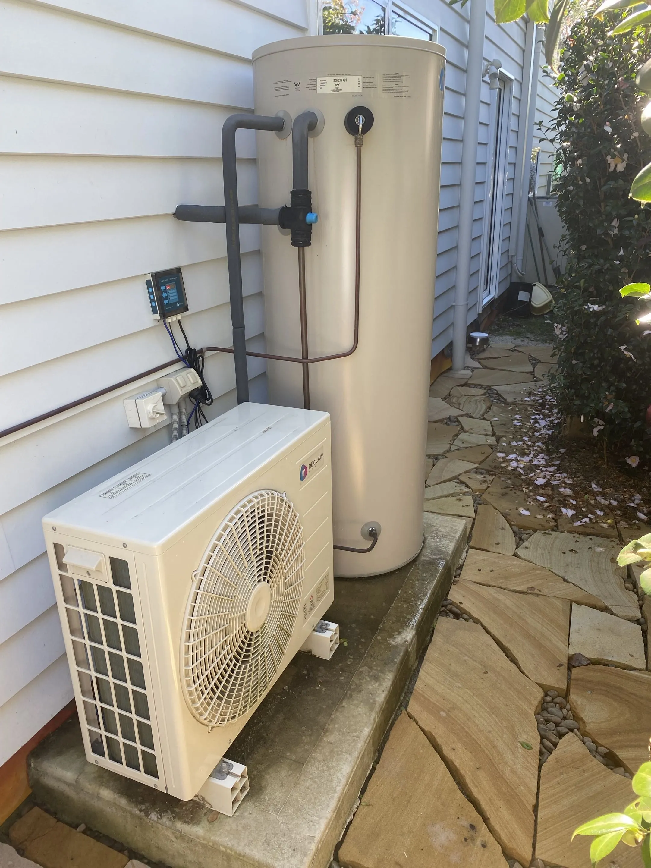 Reclaim Energy CO2 heat pump controller mounted inside a Northern Beaches home